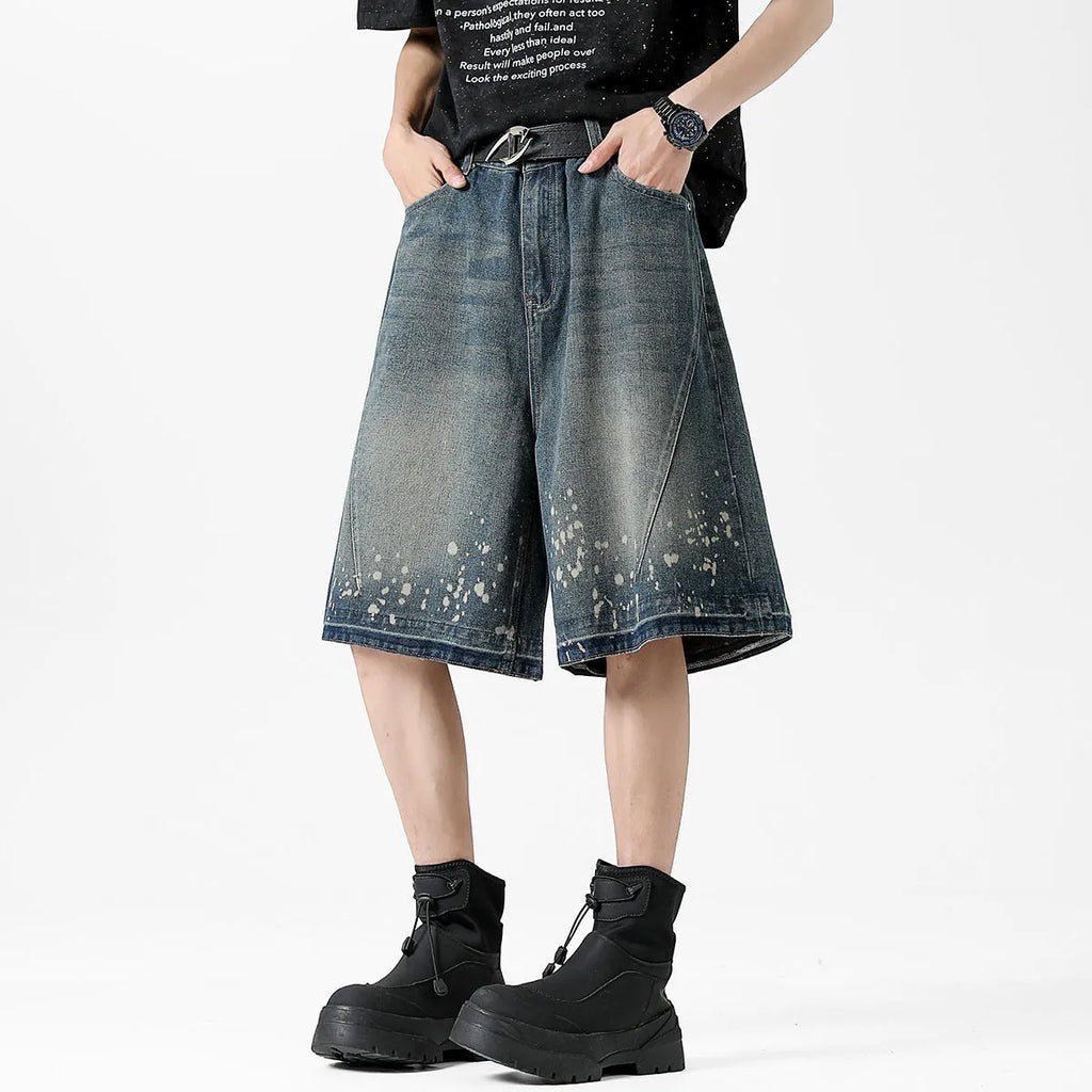 Men's retro blue washed denim shorts with ripped splash ink detailing, straight cut design
