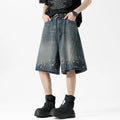 Men's retro blue washed denim shorts with ripped splash ink detailing, straight cut design