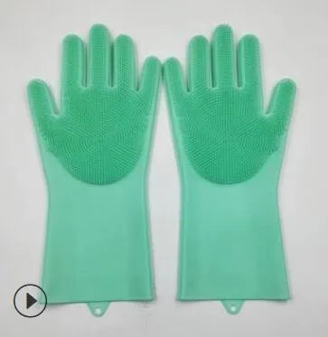 A pair of blue silicone cleaning gloves with a textured sponge-like surface for scrubbing.