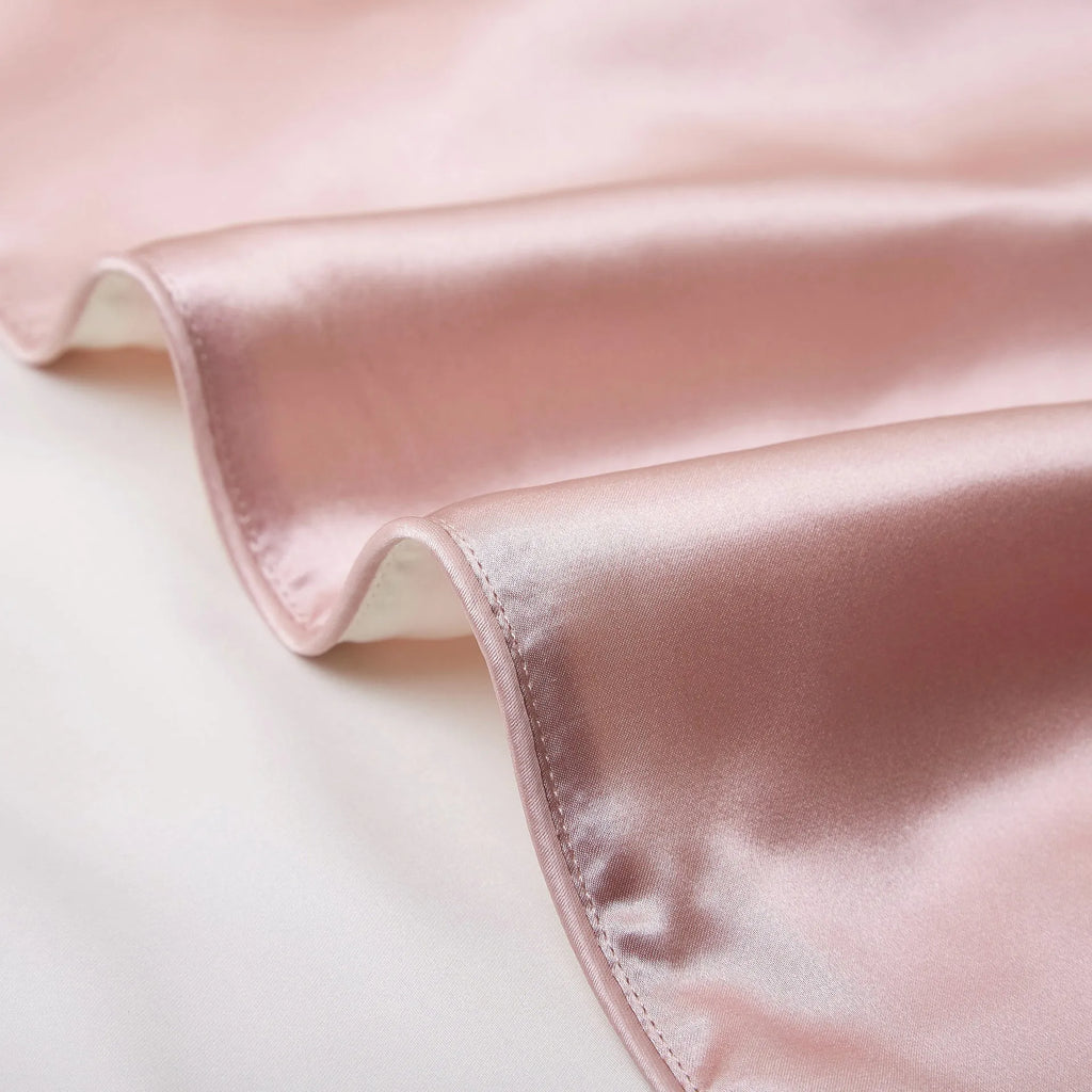 Single mulberry silk pillowcase in palace luxury style, shown in a selection of available colours.