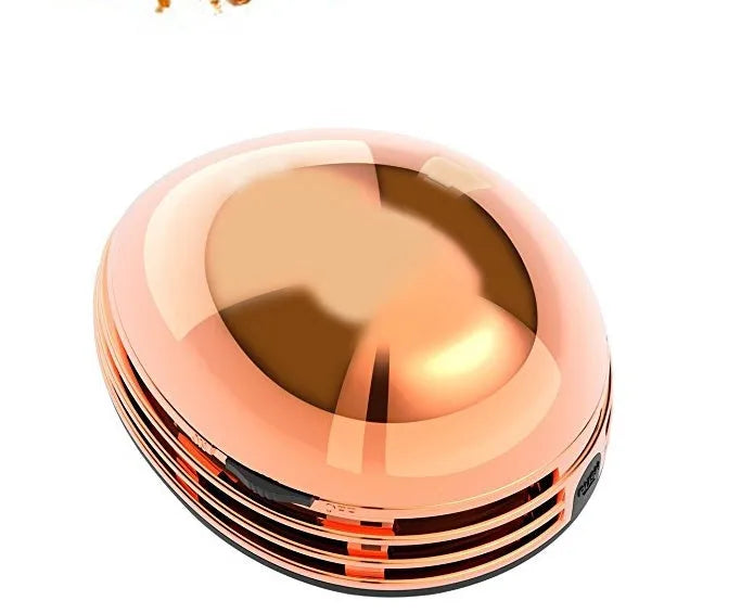 Portable mini desktop vacuum cleaner in gold, 18x12x10cm, handheld for desk and keyboard cleaning
