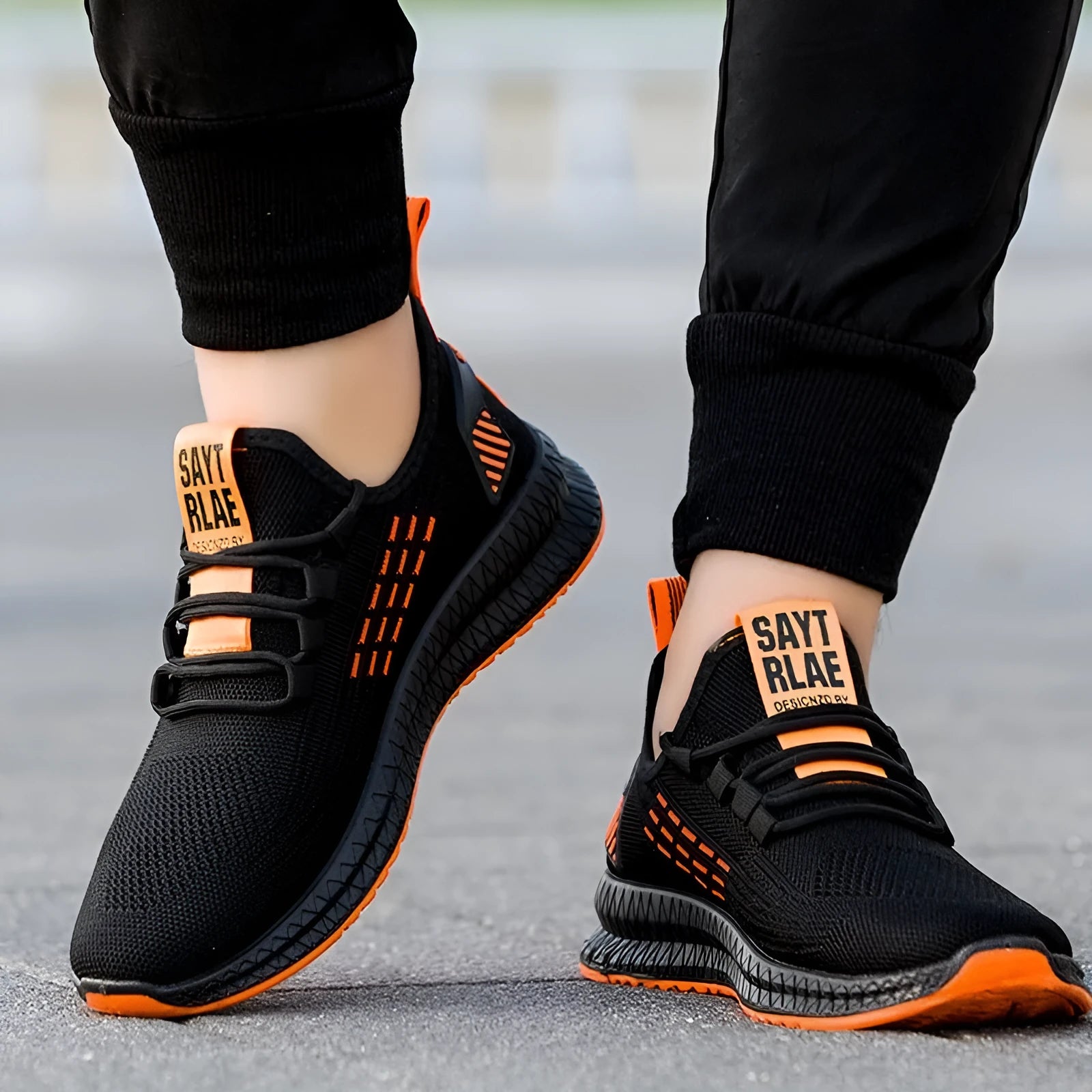 Men's flying weave sports shoes with three stripes, low heel, and round toe in black orange or yellow