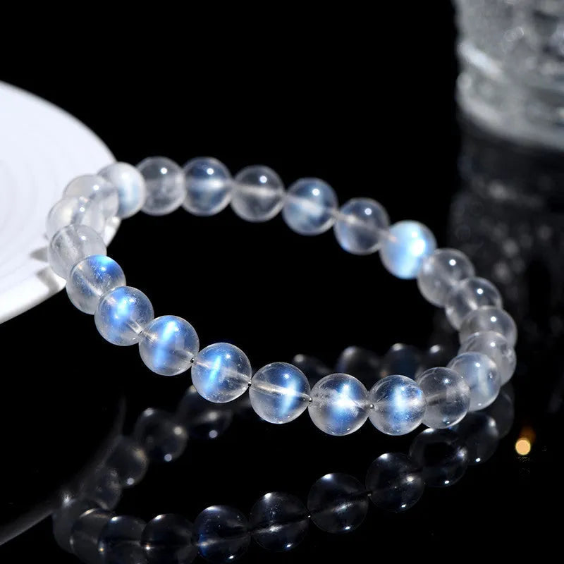 Natural cream body crystal bracelet with blue moonlight design showing minimalist unisex style