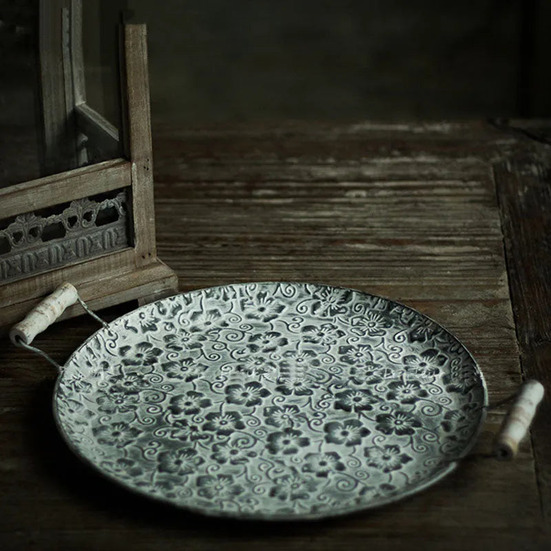 Round wrought iron belt storage tray in two sizes for home organisation.