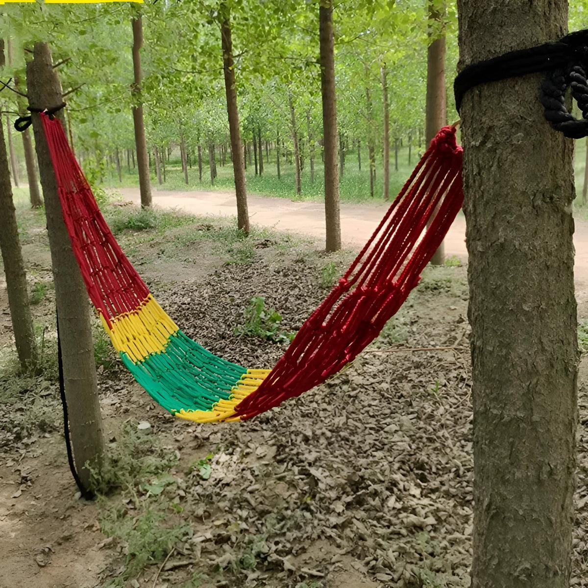 Nylon rope mesh hammock suspended outdoors showing 1.1m width and open construction