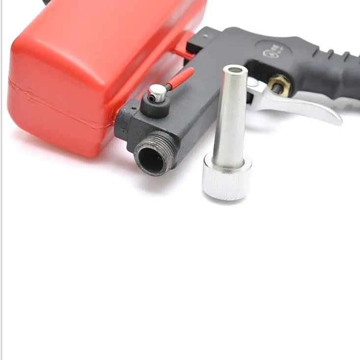 Portable black pneumatic sandblasting gun with gravity feed tank for rust removal and descaling work.