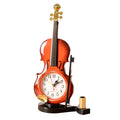 Brown violin pen inserted alarm clock with LED and pointer display on desk