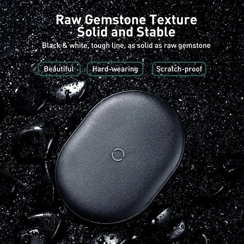 Baseus Rough 15W fast wireless charging pad for mobile phones in black colour on a desk.