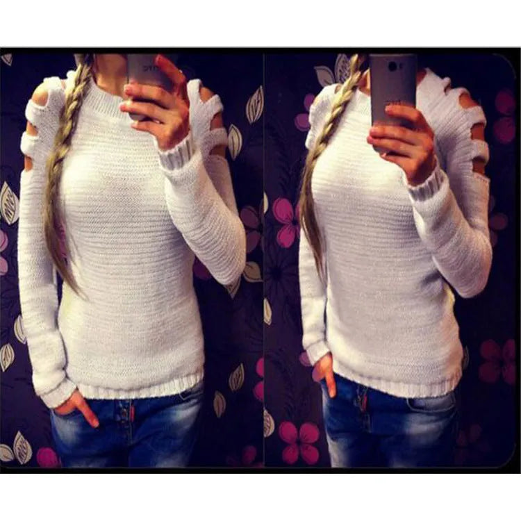 Women's grey hollow-out crochet knitted long sleeve shirt with round neck on a hanger.