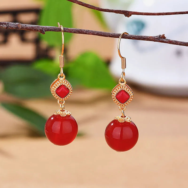 Southern Red Agate round bead earrings with S925 silver inlaid jasper detail in geometric copper alloy design