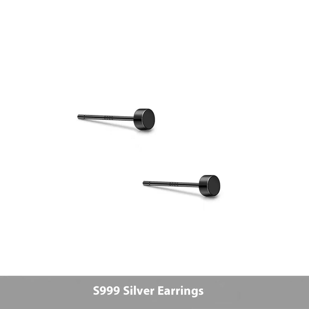 A pair of flat, round S999 sterling silver ear studs on a plain background, shown in silver and black colour options.