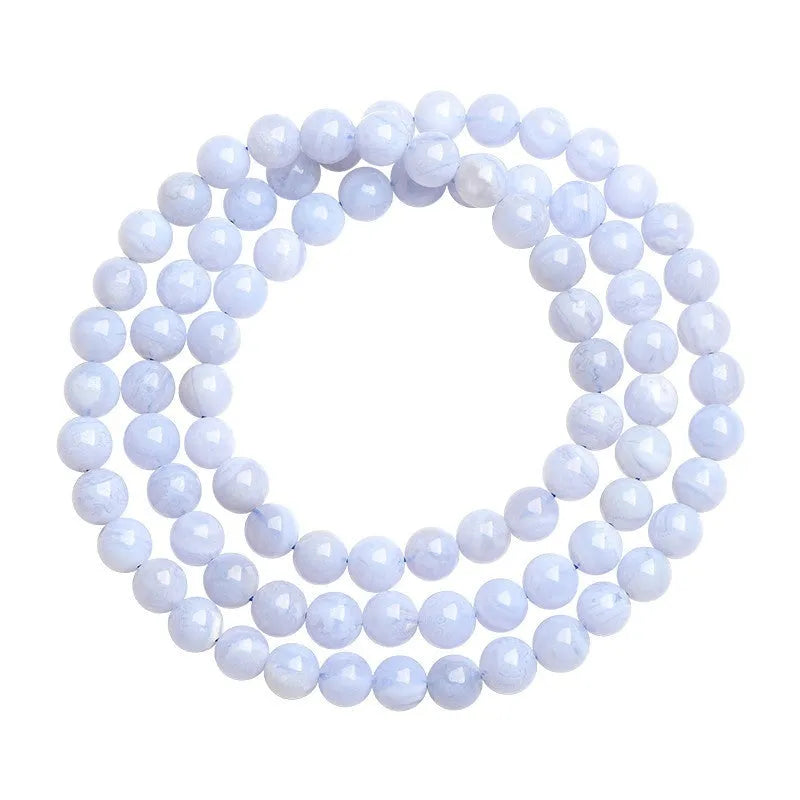 Natural blue agate bracelet with multi-circle patterns and scattered Ruyi elements on wrist