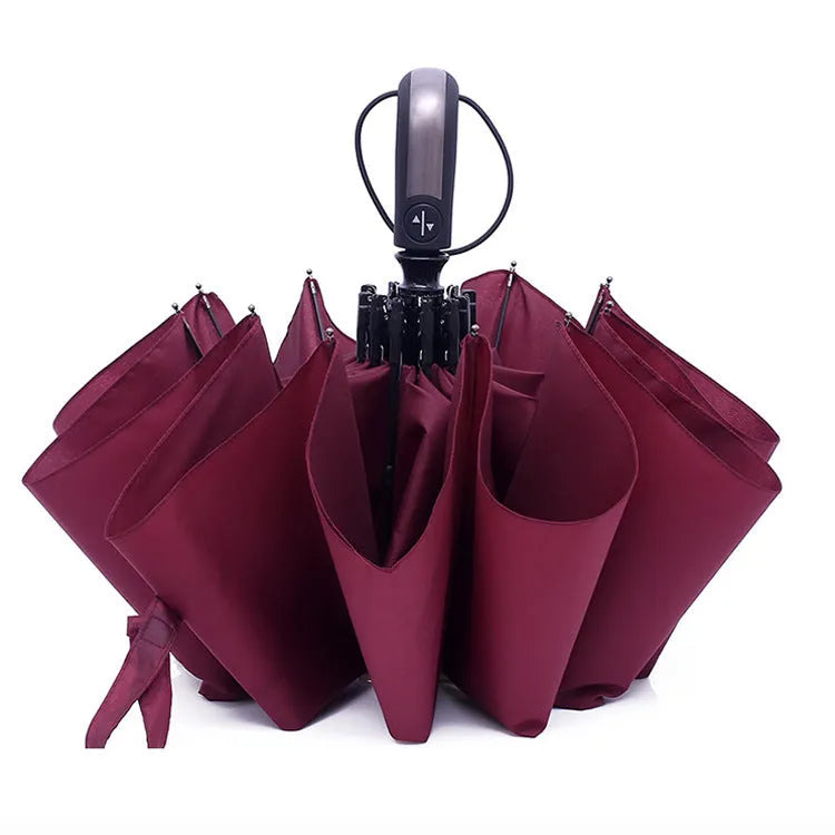 Triple-folding automatic business umbrella with steel frame and rubber handle in black, navy, or wine red.