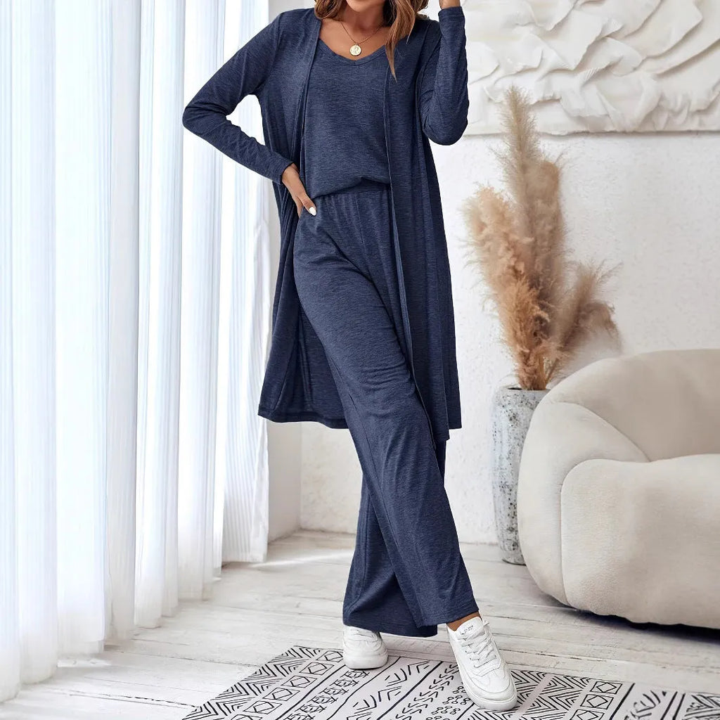Blue women's three-piece co-ord set with sling top, long cardigan, and trousers on a hanger.