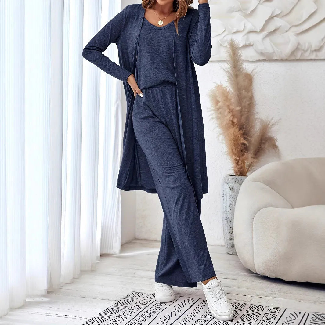 Blue women's three-piece co-ord set with sling top, long cardigan, and trousers on a hanger.