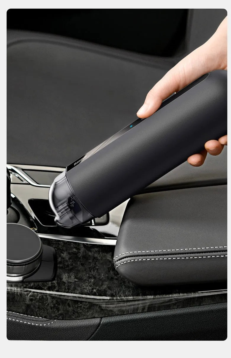 Baseus wireless handheld car vacuum cleaner in black, showing mini size and nozzle attachments.