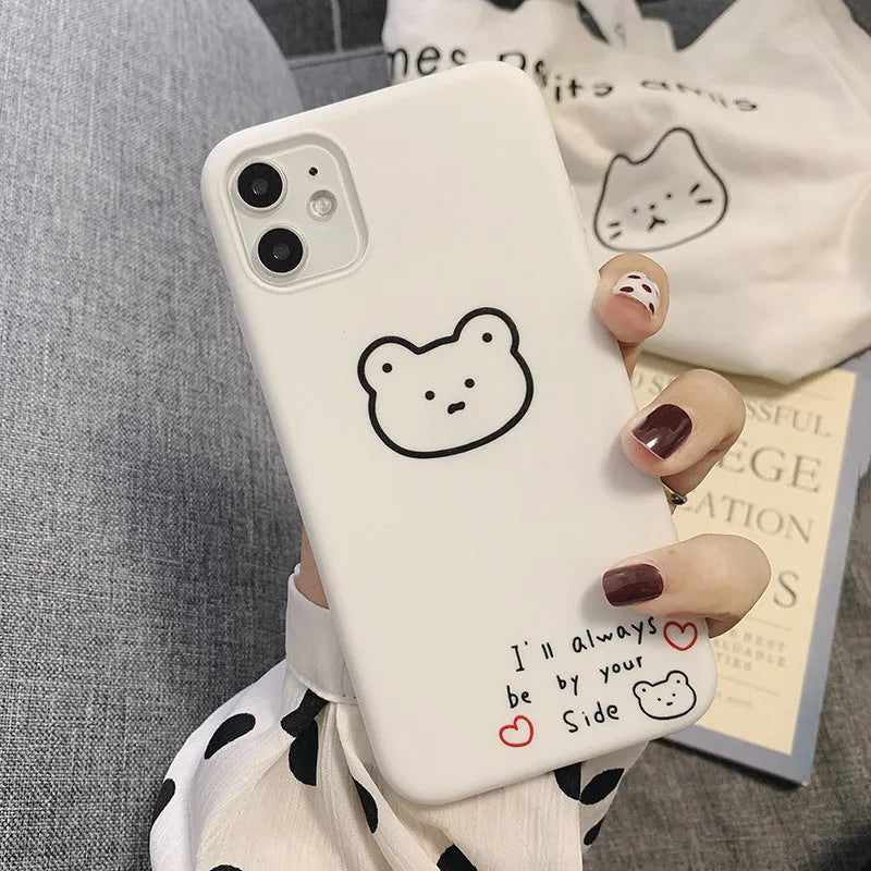 Soft silicone iPhone case with a printed Korean bear cartoon design on the back.