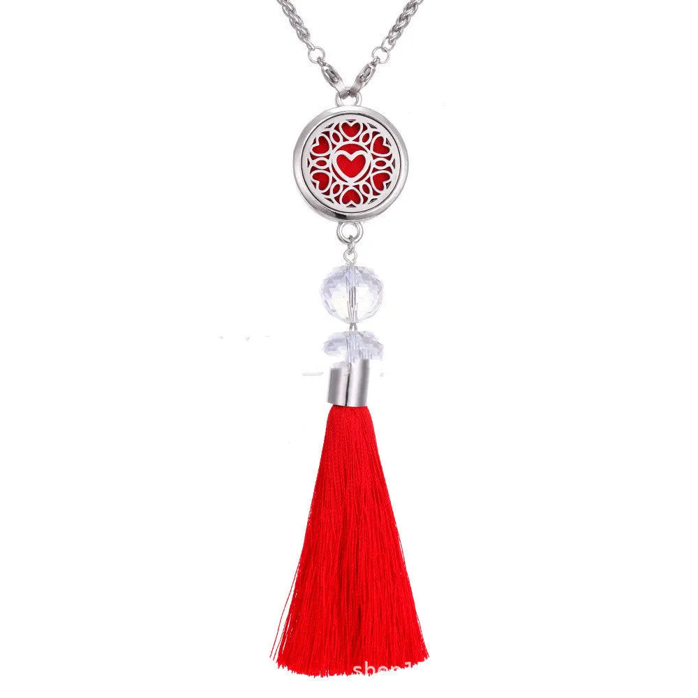 Silver alloy tassel car pendant on a chain with coloured scent cotton pads for essential oils.