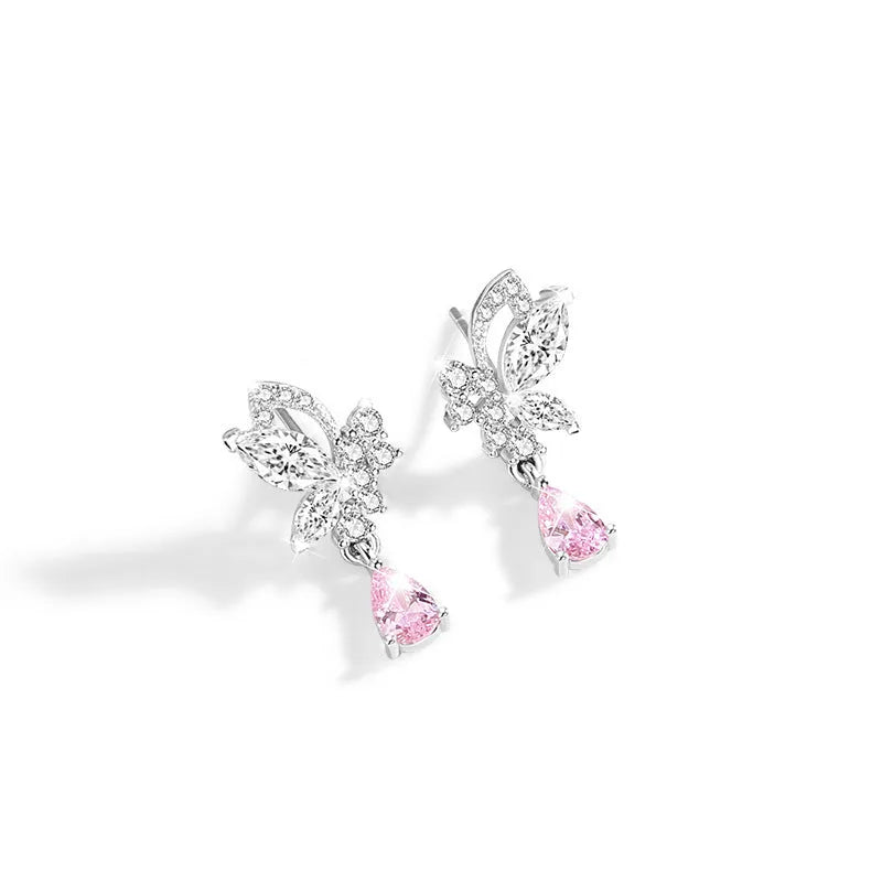 A pair of silver stud earrings with a faceted crystal butterfly design on a post backing.