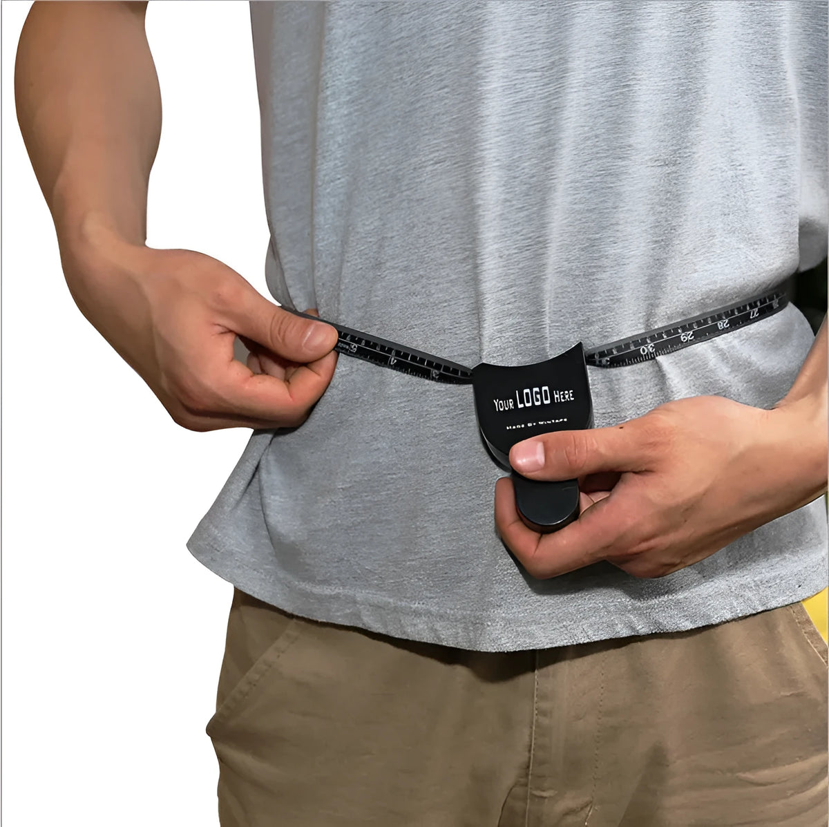 Black ABS plastic body fat caliper skinfold tester with measuring tape on a grey background.