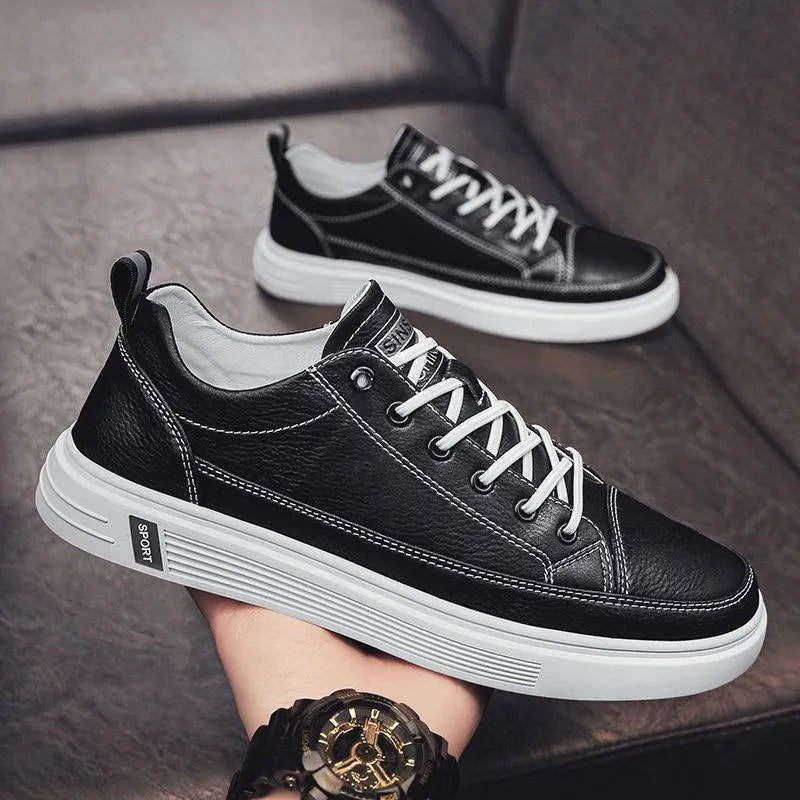 Men's white casual shoes with round toe, flat bottom, and shallow opening