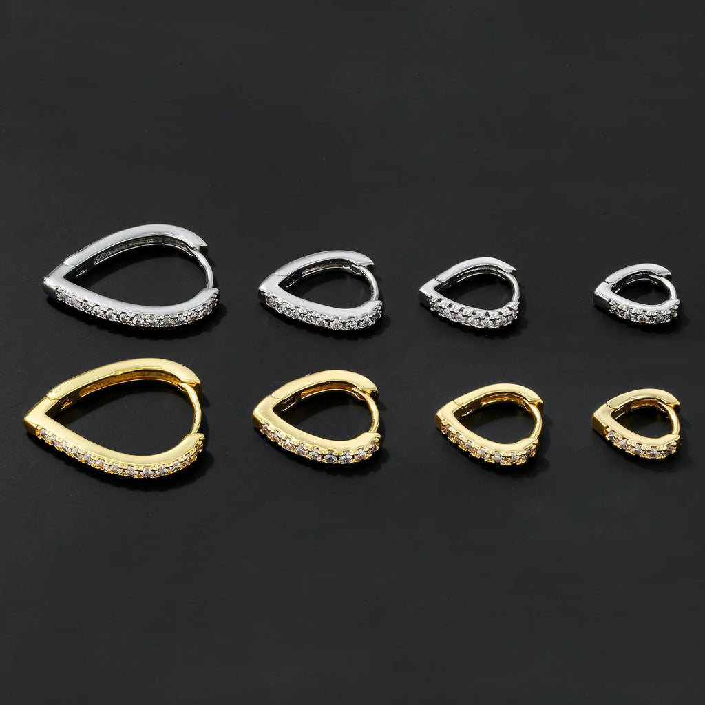 Copper geometric ear clip with love heart detail in gold electroplated finish