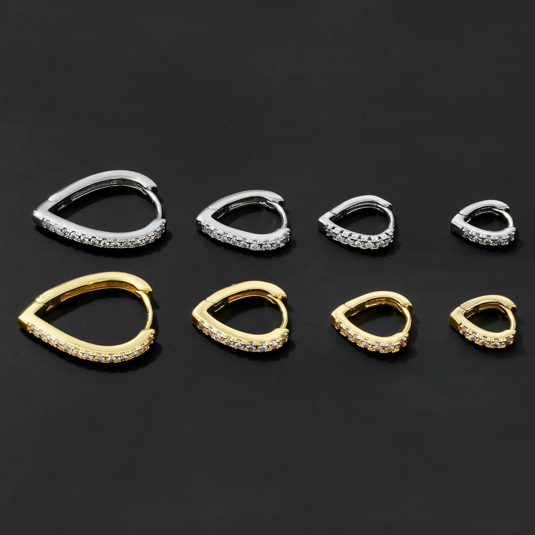 Copper geometric ear clip with love heart detail in gold electroplated finish