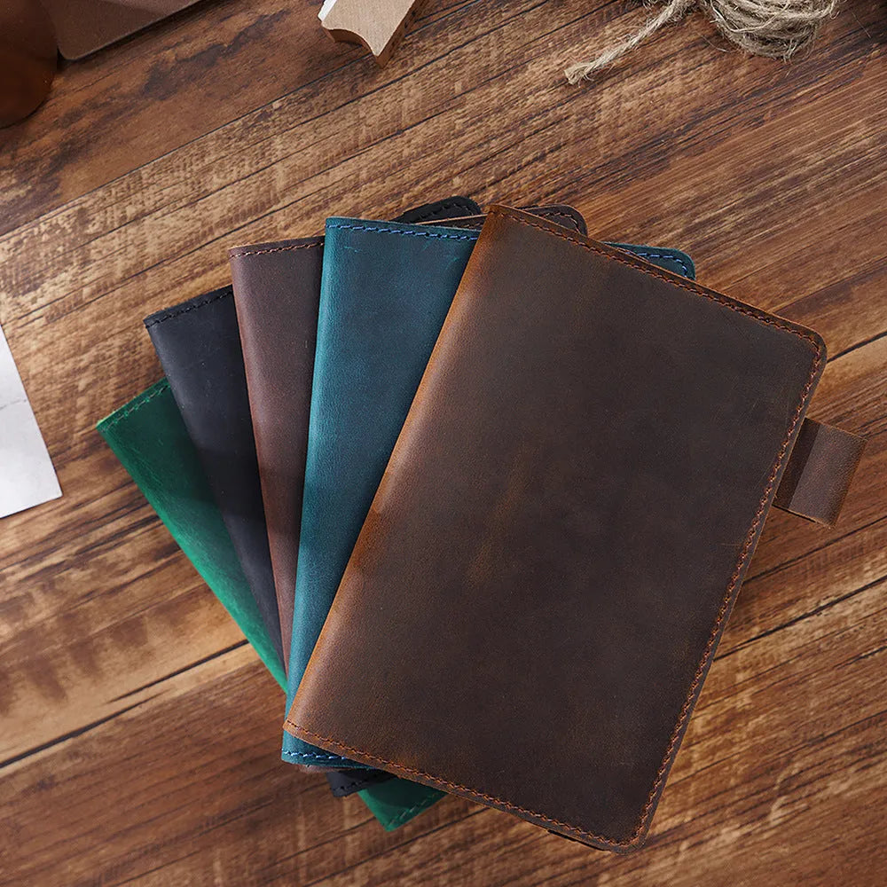 Handmade kraft notebook with a cowhide leather cover, shown open on wood-free paper.
