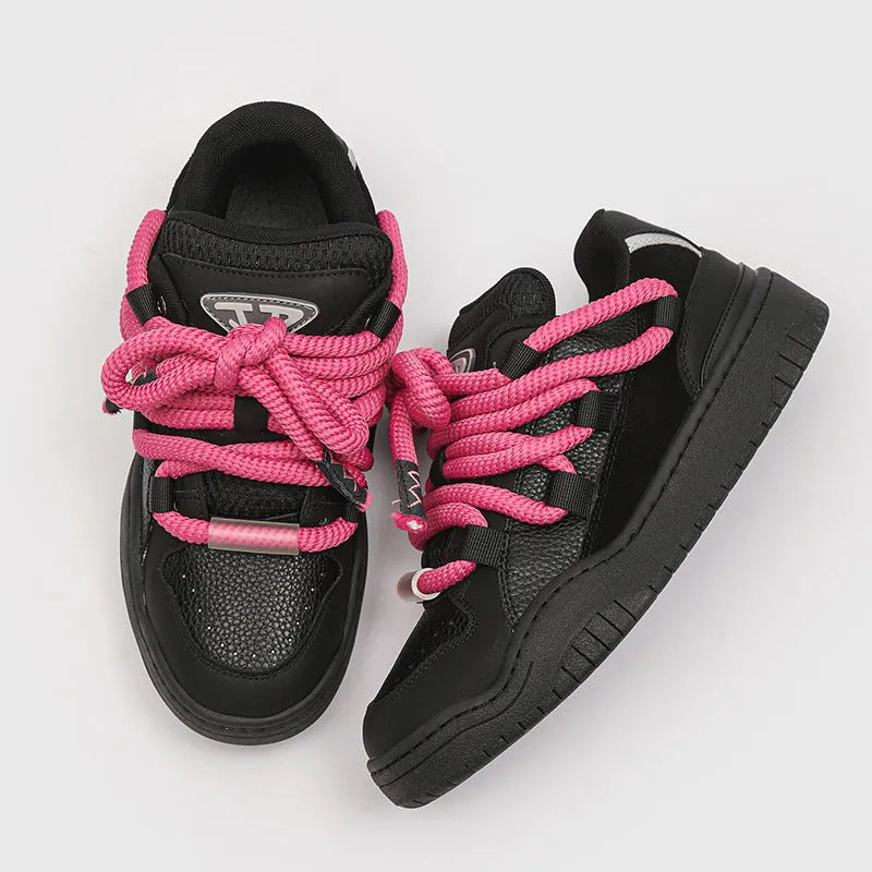 Thick bottom lace-up casual sneakers in denim blue with a round toe and flat rubber sole.