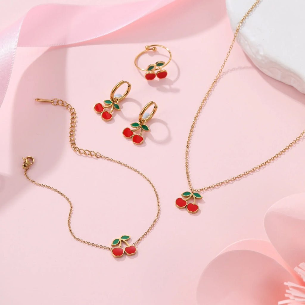 Cherry jewellery set with four 18K electroplated stainless steel pieces including necklace, bracelet, earrings, and ring