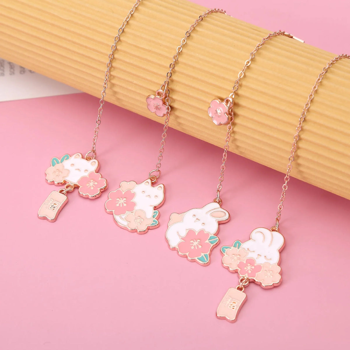 Metal pendant bookmark with cartoon cherry blossom cat and rabbit designs for books and journals