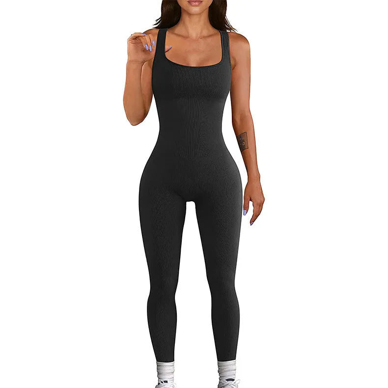 Women's black suspender tank top tights with button fastenings at shoulders showing full-length spandex construction