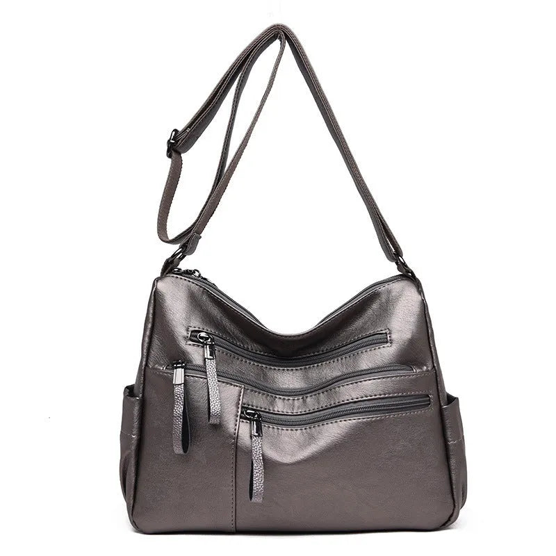 Women's messenger bag in soft PU leather, horizontal square shape with zipper closure, available in five colours