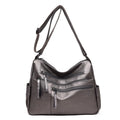 Women's messenger bag in soft PU leather, horizontal square shape with zipper closure, available in five colours