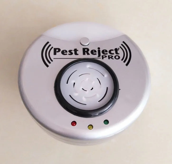 Silver grey intelligent ultrasonic mosquito repellent measuring 10cm, plugged into a white wall socket for indoor pest control