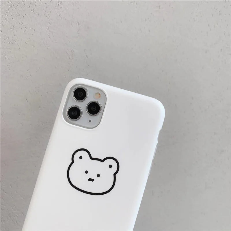 Soft silicone iPhone case with a printed Korean bear cartoon design on the back.