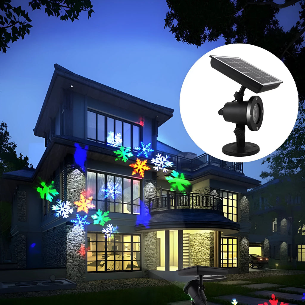 Garden Snow Lamp solar LED snowflake light with red, green, and blue multicolour glow placed in a garden lawn