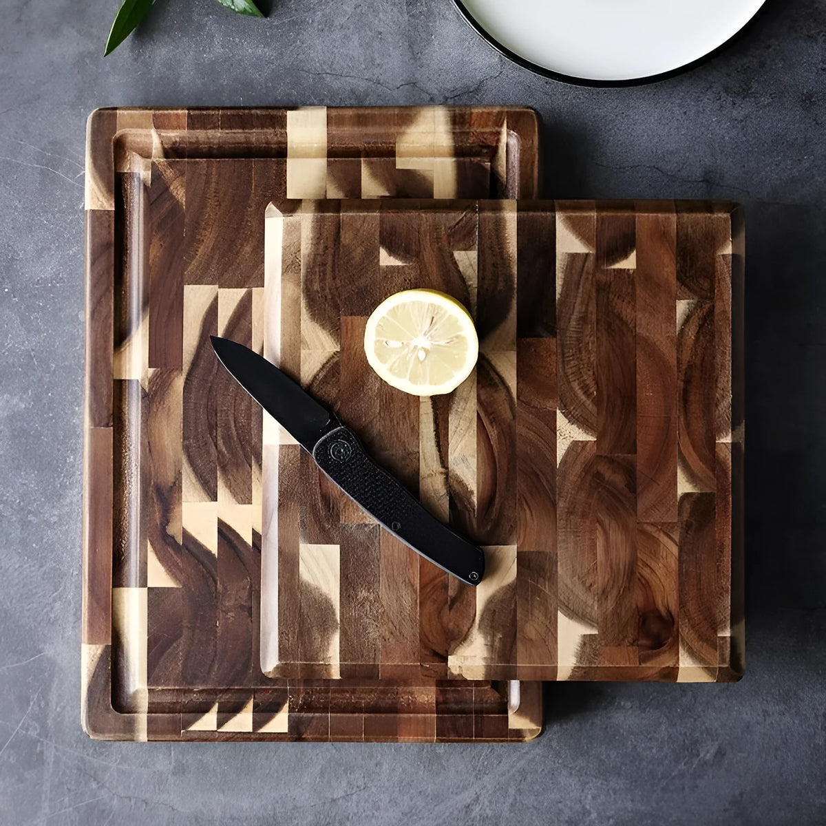 Brown acacia solid wood chopping board with parquet design, 3cm thick, on a kitchen counter