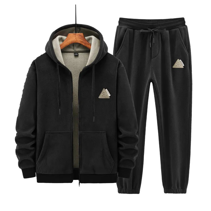 Grey casual sports suit set featuring a hooded long-sleeve sweater and matching trousers on a hanger.