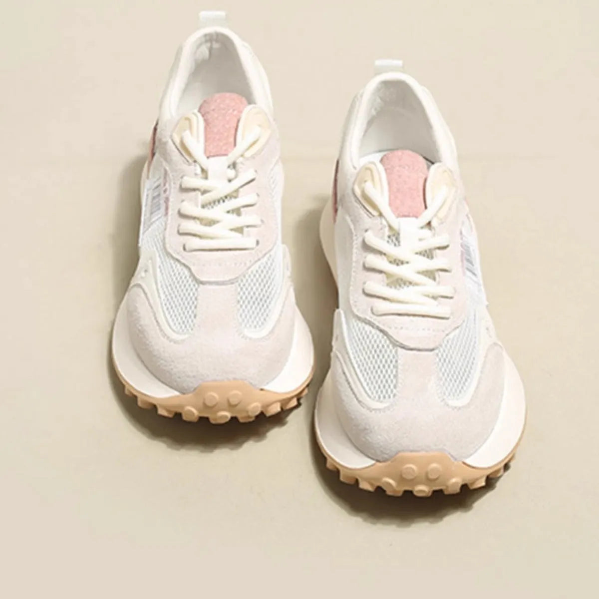 Women's grey and pink low-top retro sneakers with mesh lining and rubber sole