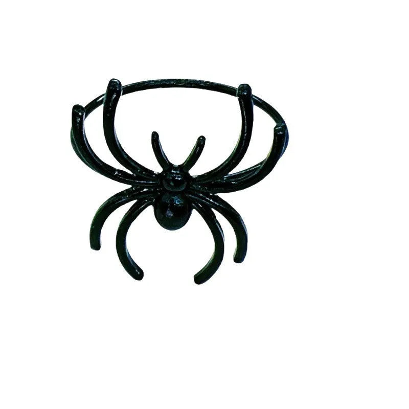 Six black spider-shaped alloy napkin rings for Halloween table decoration.