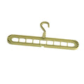 Multifunctional plastic hanger with nine holes for trousers, shown in folded position for space saving