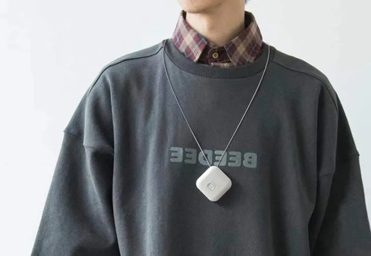 USB rechargeable mini air purifier necklace in blue, showing compact design worn around neck.