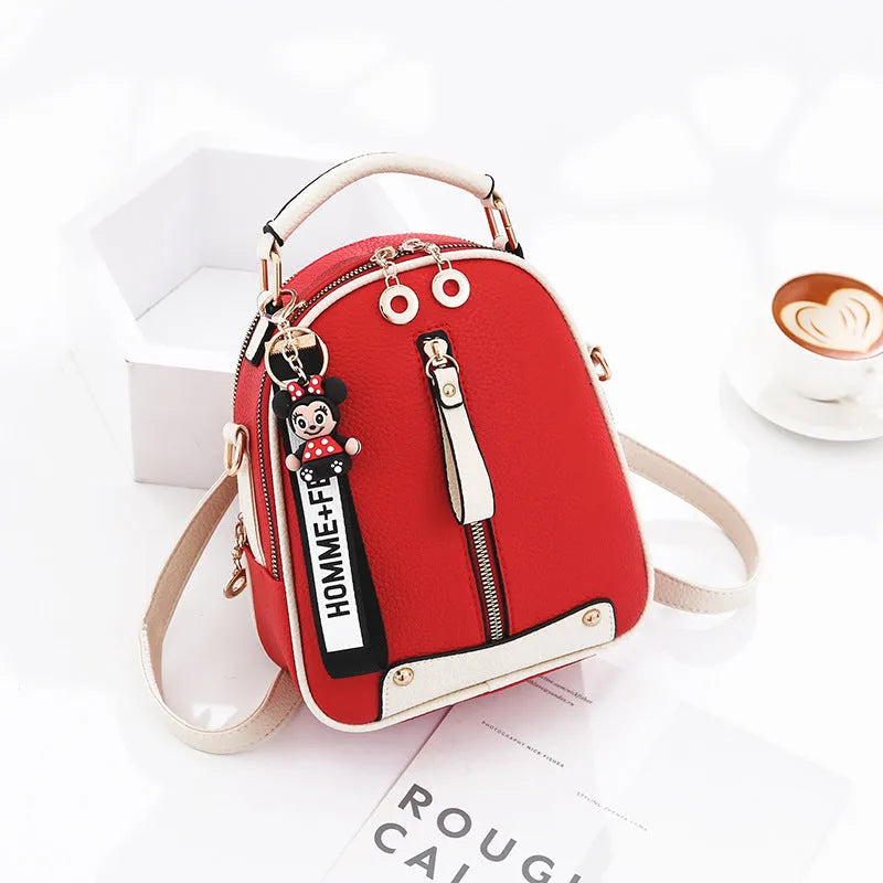 Fashion backpack for women in PU leather oval shape with double shoulder straps and car suture detail