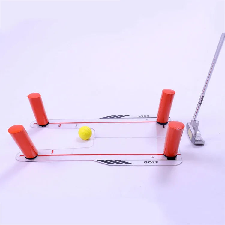 Red plastic putting practice mirror for golf alignment training on grass