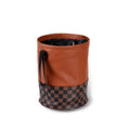 Retractable leather car bin showing folding design with carry handle for vehicle waste management