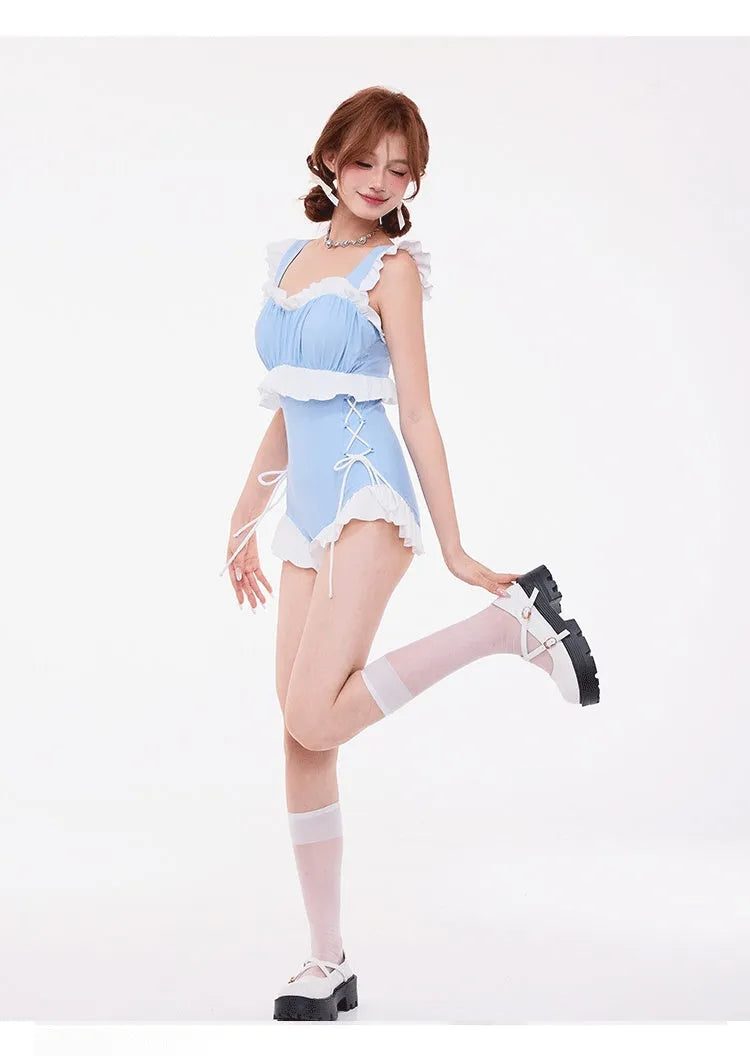 Light blue women's high-waisted one-piece swimsuit with lace chest detail and backless design.