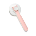 Self-cleaning slicker brush for dogs and cats with blue rubber handle and stainless steel bristles.