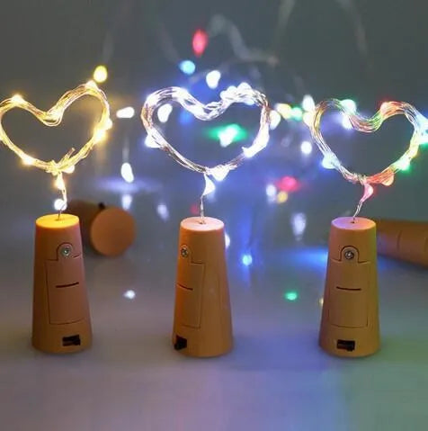 Flexible copper wire LED string light with bottle stopper for wine bottle decoration.