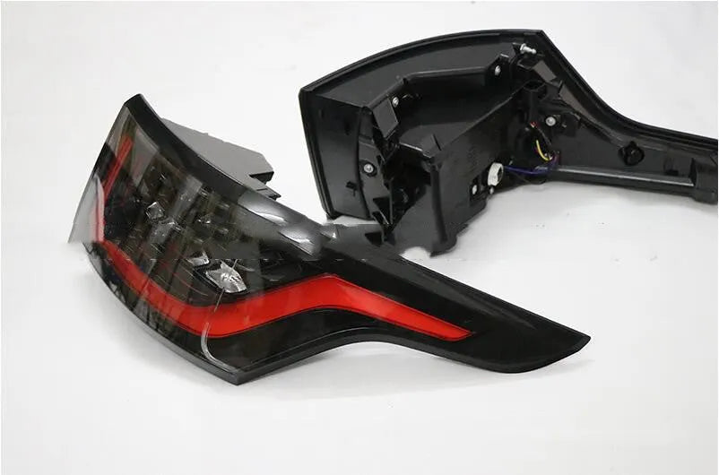 Pair of LED rear bumper brake light units for car taillight replacement.
